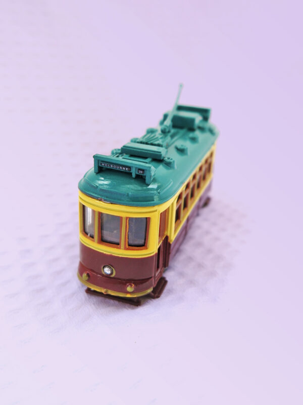 A metal model of a City Circle tram in the maroon colour.
