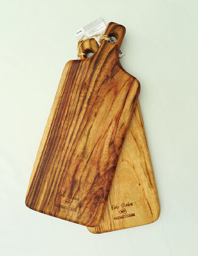 Two large wooden paddle chopping boards