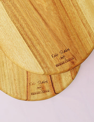 Two wooden pizza chopping boards