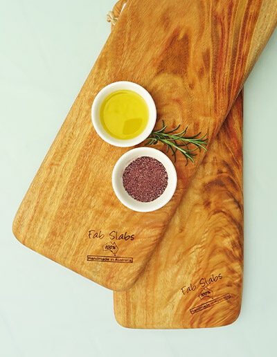 Two small chopping boards with a dish of salt & a dish of oil