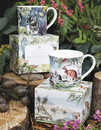 The two Wildlife Australia mug designs, treetops and grassland, shown on the two mugs and two gift boxes