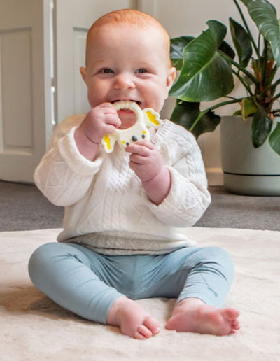 Silicone Teether Cockatoo being held by a baby